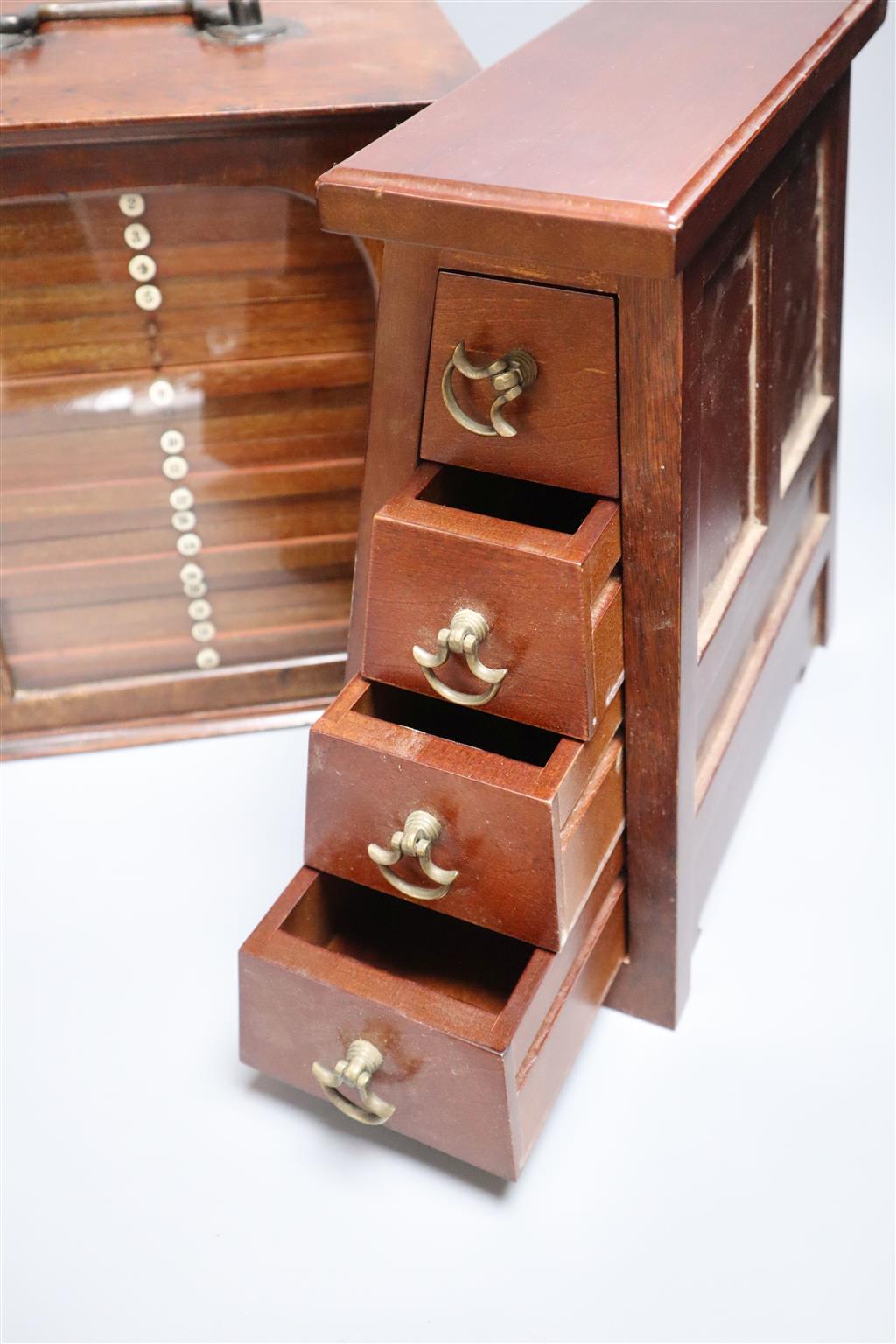 A Victorian mahogany coin collectors cabinet, 27cm wide, and a mahogany table top bank of four drawers